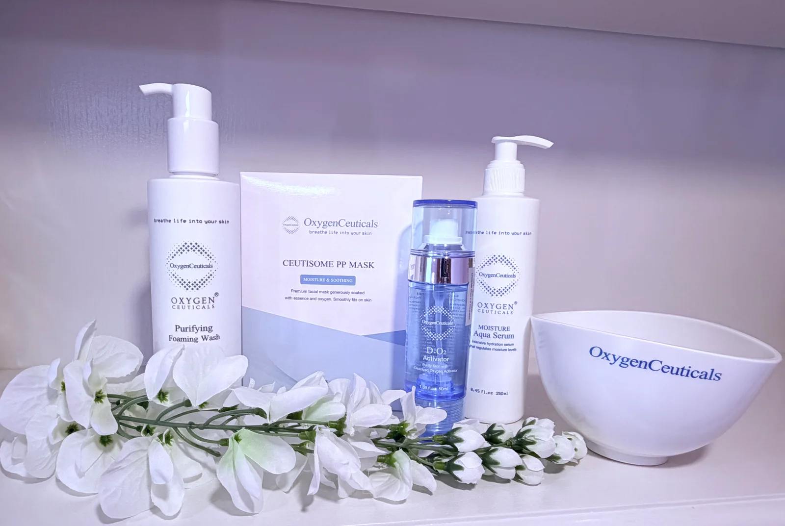 OxygenCeuticals professional skincare products on a shelf at KDL Aesthetics in Franklin, MA